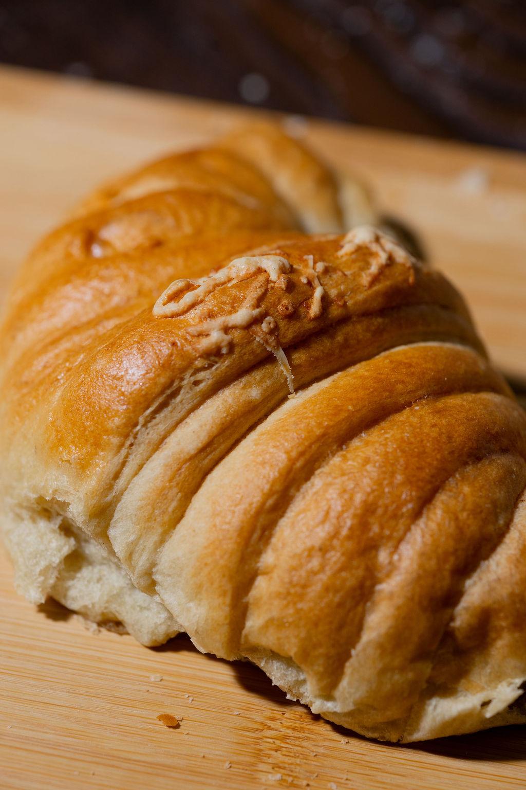 Cheese-topped braided bread, fresh from the oven